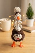 Hot Cocoa Cutie desk goose in a cozy desktop setting
