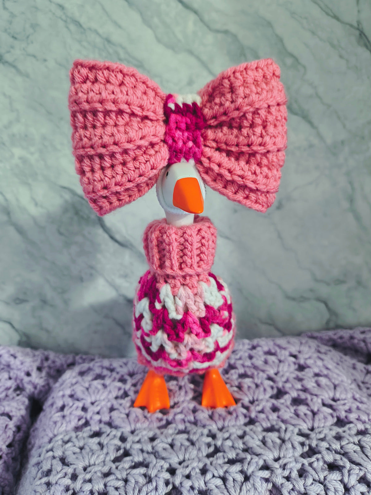 Pink crochet desk goose turtleneck sweater with large pink bow - side view